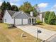 Charming home with a spacious driveway and well-manicured lawn at 3227 Grove Trl, Acworth, GA 30101