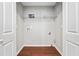 Laundry room with washer and dryer hookups, wire shelving, and neutral paint at 3227 Grove Trl, Acworth, GA 30101