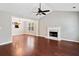 Bright living room with hardwood floors, a vaulted ceiling, fireplace, and ample natural light at 3227 Grove Trl, Acworth, GA 30101