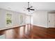 Bright living room with hardwood floors, a vaulted ceiling, fireplace, and ample natural light at 3227 Grove Trl, Acworth, GA 30101