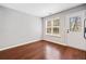 Mud room area with a window, access to the backyard and wood-styled vinyl flooring at 3227 Grove Trl, Acworth, GA 30101