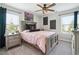 Cozy bedroom with a bed, dresser, and large windows providing natural light at 3628 Silvery Way, Powder Springs, GA 30127
