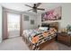 Comfortable bedroom showcasing a bed with decorative pillows and natural light from a window at 3628 Silvery Way, Powder Springs, GA 30127