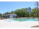Enjoy the community pool with a water feature and lounge chairs on a sunny day at 3628 Silvery Way, Powder Springs, GA 30127