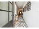 Inviting entryway featuring modern decor, stylish rugs, and a view into the open-concept living spaces at 3628 Silvery Way, Powder Springs, GA 30127