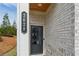 Inviting entryway with a stylish front door, brick facade, and visible house number at 3628 Silvery Way, Powder Springs, GA 30127
