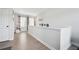Bright hallway with wood floors and railing on the second floor at 3628 Silvery Way, Powder Springs, GA 30127