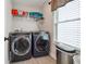 Well-equipped laundry room with modern washer and dryer units, plus a window at 3628 Silvery Way, Powder Springs, GA 30127