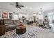 Open-concept living room featuring a kitchen, dining area, and a cozy seating area with stylish furnishings and decor at 3628 Silvery Way, Powder Springs, GA 30127