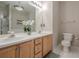 Light filled bathroom featuring double sinks, tile flooring and walk-in shower at 375 Highland Ne Ave # 903, Atlanta, GA 30312