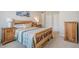 Comfortable bedroom showcasing a carved wood bed frame and matching wood furnishings at 375 Highland Ne Ave # 903, Atlanta, GA 30312