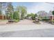 Gated community entrance with brick pillars and mature landscaping at 375 Highland Ne Ave # 903, Atlanta, GA 30312