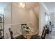 Cozy dining area with a glass table and modern decor next to a wall of windows at 375 Highland Ne Ave # 903, Atlanta, GA 30312