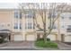 Attractive townhome with bay windows, brick driveway, and attached one car garage at 375 Highland Ne Ave # 903, Atlanta, GA 30312