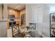 Eat-in kitchen featuring stainless steel appliances, wood cabinets, and modern fixtures at 375 Highland Ne Ave # 903, Atlanta, GA 30312