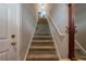 Carpeted staircase with neutral paint and white railings leading to the upper level at 375 Highland Ne Ave # 903, Atlanta, GA 30312