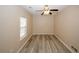 This bedroom offers hardwood flooring and a ceiling fan at 5364 Hickory Knl, Norcross, GA 30071