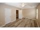 Bedroom featuring vaulted ceiling, hardwood floors, and a neutral color scheme at 5364 Hickory Knl, Norcross, GA 30071