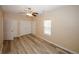 This bedroom features a closet, hardwood flooring, and a ceiling fan at 5364 Hickory Knl, Norcross, GA 30071