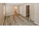 Bedroom showcasing wood flooring, neutral walls, and doorways to other rooms at 5364 Hickory Knl, Norcross, GA 30071