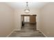 Open dining room with views to the living room and neutral decor at 5364 Hickory Knl, Norcross, GA 30071