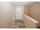 Second floor hallway features wood-look flooring and natural lighting at 5364 Hickory Knl, Norcross, GA 30071