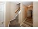 The hallway features carpeted stairs and hardwood flooring at 5364 Hickory Knl, Norcross, GA 30071