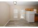 Bright eat-in kitchen with white appliances and wood flooring at 5364 Hickory Knl, Norcross, GA 30071