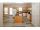 Bright kitchen featuring an island, white appliances, and natural light at 5364 Hickory Knl, Norcross, GA 30071