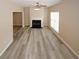 Bright living room with fireplace, ceiling fan, and wood flooring at 5364 Hickory Knl, Norcross, GA 30071