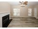 Spacious living room with fireplace, wood floors, and natural light at 5364 Hickory Knl, Norcross, GA 30071