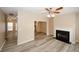 Open living room featuring a fireplace and wood-style flooring at 5364 Hickory Knl, Norcross, GA 30071