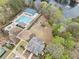 Aerial view of the community pool, playground, and pond, showcasing various recreational amenities at 940 Magnolia Blossom Ct, Alpharetta, GA 30005