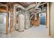 Unfinished basement area with a water heater and HVAC system at 940 Magnolia Blossom Ct, Alpharetta, GA 30005