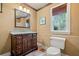 Bathroom featuring a wooden vanity and toilet at 940 Magnolia Blossom Ct, Alpharetta, GA 30005