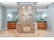 Luxurious bathroom featuring a spacious walk-in shower and double vanities at 940 Magnolia Blossom Ct, Alpharetta, GA 30005