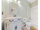 Bathroom with a tiled shower and white vanity at 940 Magnolia Blossom Ct, Alpharetta, GA 30005