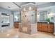 Ensuite bathroom with vanities, step-in shower, and view to main bedroom at 940 Magnolia Blossom Ct, Alpharetta, GA 30005