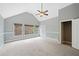 Large bedroom with a ceiling fan, three windows and a closet at 940 Magnolia Blossom Ct, Alpharetta, GA 30005