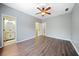 Bedroom with hard wood floors, ceiling fan and attached bathroom at 940 Magnolia Blossom Ct, Alpharetta, GA 30005