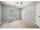 Comfortable bedroom with a large window providing natural light at 940 Magnolia Blossom Ct, Alpharetta, GA 30005