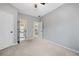 Neutral bedroom with multiple doors offers versatility at 940 Magnolia Blossom Ct, Alpharetta, GA 30005