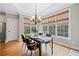 Bright dining room offers natural light and ample space for entertaining at 940 Magnolia Blossom Ct, Alpharetta, GA 30005