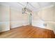 Formal dining room with hardwood floors, and decorative chair rail at 940 Magnolia Blossom Ct, Alpharetta, GA 30005