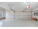 Spacious, clean two-car garage with ample lighting and storage potential at 940 Magnolia Blossom Ct, Alpharetta, GA 30005