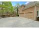 Attached two-car garage with wide driveway, offering convenience and parking space at 940 Magnolia Blossom Ct, Alpharetta, GA 30005