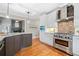 Gourmet kitchen features stainless steel appliances, granite countertops and custom cabinets at 940 Magnolia Blossom Ct, Alpharetta, GA 30005