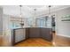 Kitchen island boasts granite countertops, stainless steel appliances and a breakfast bar at 940 Magnolia Blossom Ct, Alpharetta, GA 30005