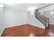 Living room with hardwood floors and stairs at 940 Magnolia Blossom Ct, Alpharetta, GA 30005