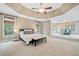 Large bedroom with sitting area, multiple windows and trey ceiling at 940 Magnolia Blossom Ct, Alpharetta, GA 30005